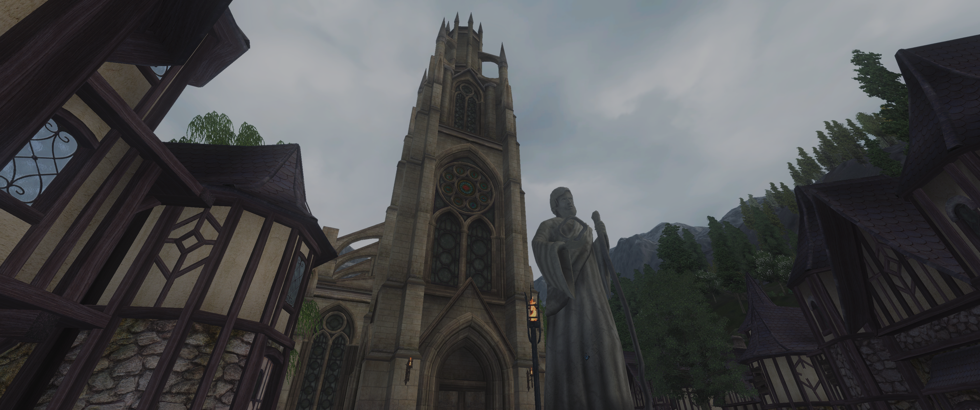 Screenshot of the game. A tall, gothic church with a statue in front of it during the day.